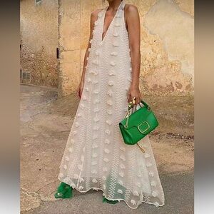 Elegant White Maxi Dress with Green Accessories